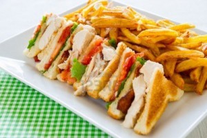 13582670-chicken-club-sandwich-in-a-white-plate-meal-time